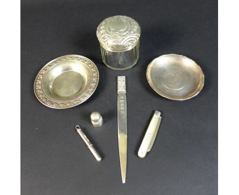 A group of silver items comprising two photograph frames, one of Victorian rococo style, the other rectangular with anthemion
