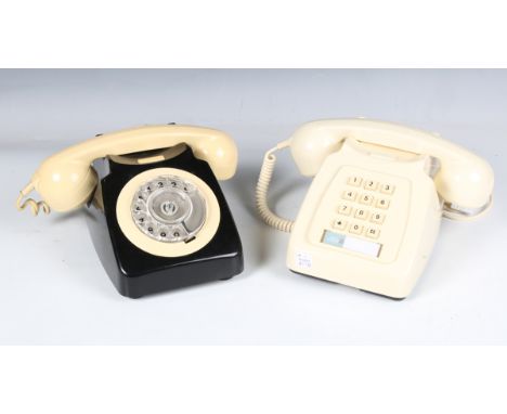 A mid-20th century cream and black plastic rotary telephone, the underside detailed '746F SPK 71/1', together with another cr