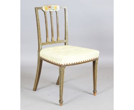 A George III Sheraton period green painted side chair, the comb back with a floral painted reserve above a silk padded seat, 