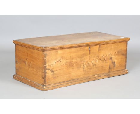 A 19th century elm trunk, the hinged lid enclosing a candle box, height 33cm, width 93cm, depth 42cm.Buyer’s Premium 29.4% (i