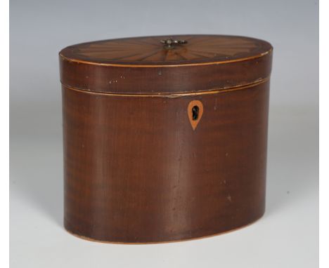 A late George III mahogany oval tea caddy, the hinged lid with an inlaid fan reserve, width 14.5cm.Buyer’s Premium 29.4% (inc