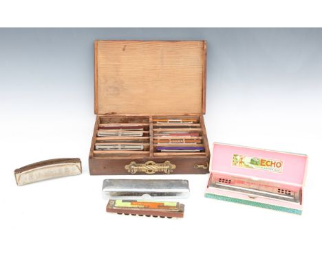 A collection of harmonicas, including an Echo harp by M. Hohner, boxed.Buyer’s Premium 29.4% (including VAT @ 20%) of the ham