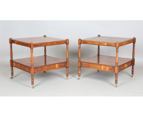 A pair of late 20th century reproduction yew two-tier lamp tables, each fitted with a single drawer, height 61cm, width 60cm,