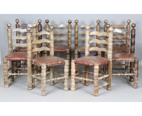 A set of eight mid-20th century French stained beech ladder back dining chairs, in the manner of Charles Dudouyt, height 95cm
