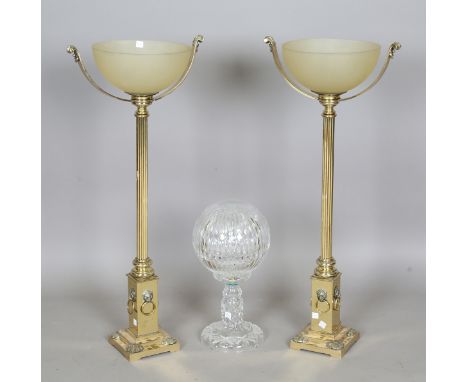 A pair of late 20th century Victorian style gilt brass table lamps, each with an opaque glass uplight shade above a reeded co