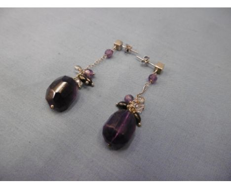 A pair of silver and amethyst drop earrings