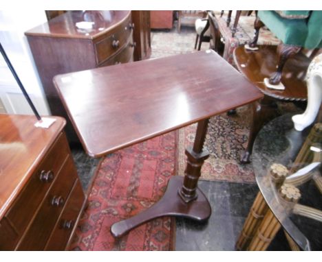 A mahogany adjustable reading table