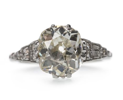 DIAMOND SOLITAIRE RING, the old cushion cut diamond of approximately 3.52 carats, on an expanding shank set with diamonds tot