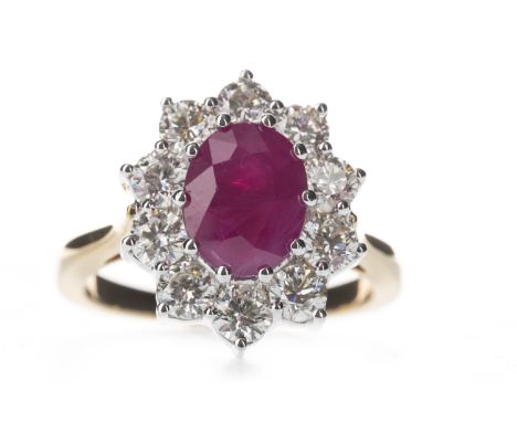 RUBY AND DIAMOND CLUSTER RING, the oval ruby within a halo of round brilliant cut diamonds totalling approximately 1.50 carat