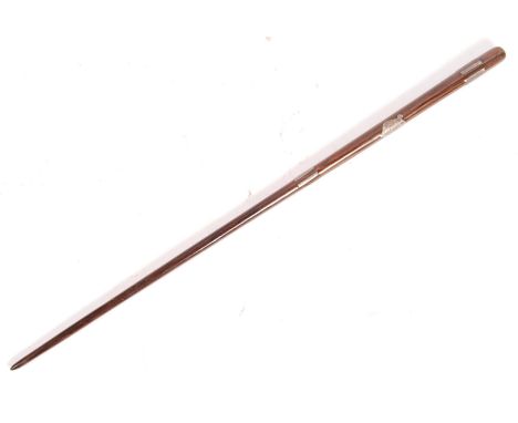 An antique early 20th century 1920's conductor's baton - tapering carved form, with inset silver plated grips and a small pla