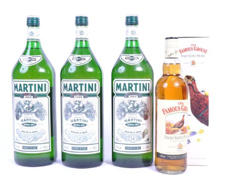 A group of 3x large 150cl bottles of Martini Extra Dry Vermouth 15% vol along with a boxed 70cl bottle of The Famous Grouse F