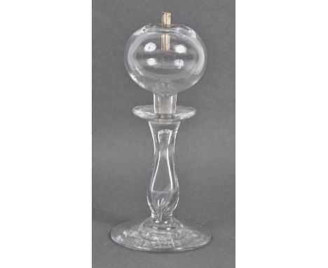 A 19th Century Victorian hand blown lead glass oil lamp of baluster shape raised on circular foot. Gadget mark to underside o