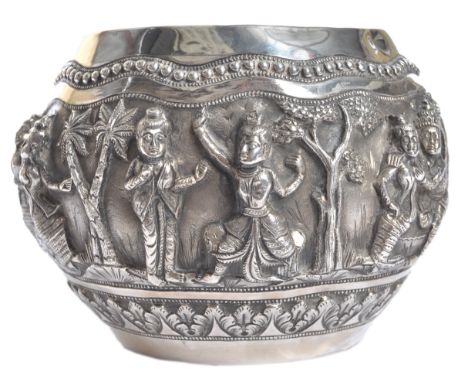 A 19th Century Indian / Burmese antique silver temple prayer bowl. Large form with relief decoration depicting figures, deiti