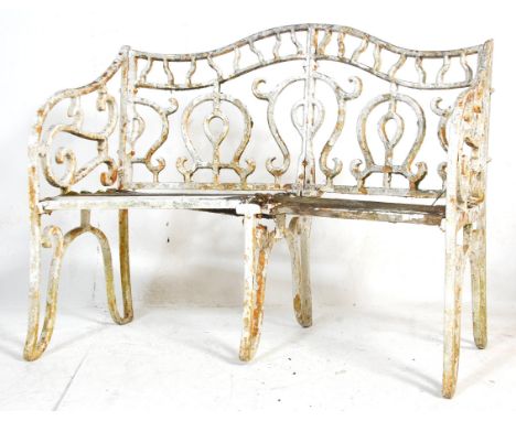 A 19th Century Victorian English antique cast iron garden bench in the manner of Coalbrookdale having squared tubular metal f