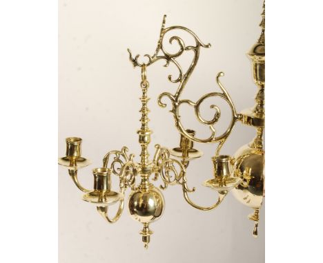 An antique 19th century pair of brass hanging chandeliers, in the 17th Century Dutch manner. Each wall sconce hanging bracket