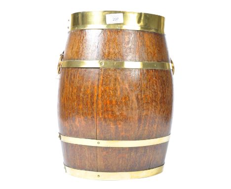 A 19th Century English antique oak stick / umbrella stand coopered barrel. Oval form with brass banded decoration having ring