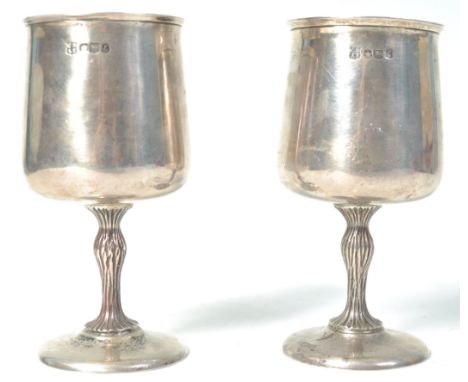 A pair of 20th Century hallmarked silver wine drinking goblets by Cooper Brothers &amp; Sons Ltd having bell shaped bowls wit