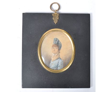 An early 19th Century Georgian English antique watercolour portrait miniature painting on paper depicting a lady in blue dres