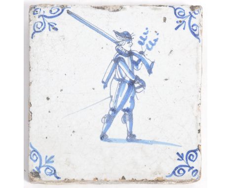 An 18th Century Dutch antique Delft tin glazed earthenware stone ceramic wall tile having hand painted blue and white decorat