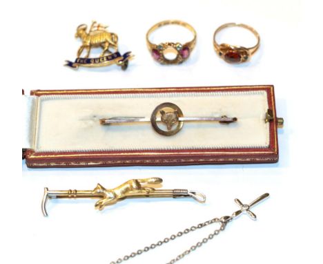 A fox mask stock pin, stamped '9CT', length 4.7cm; a running fox and hunting crop bar brooch, stamped '9CT' and 'SIL', length