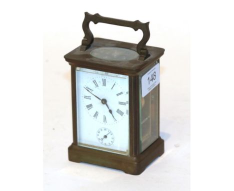 A French brass carriage clock with white enamelled dial