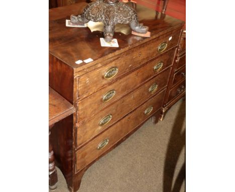A Regency style mahogany caddy topped chest of drawers, with shaped apron, raised on bracket feet