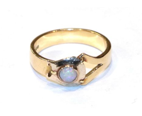 An 18 carat gold opal ring (converted from a tie pin and a wedding band), finger size L.  Gross weight 3.9 grams. 