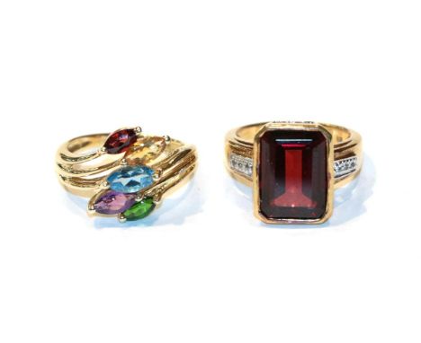 A 9 carat gold garnet, citrine, blue topaz, amethyst and tsavorite garnet ring, finger size N; and a 9 carat gold garnet ring