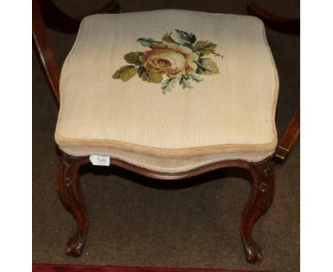 A 19th century walnut dressing stool with overstuffed seat