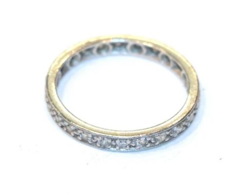A diamond eternity ring, unmarked, finger size J1/2.  Gross weight 2.1 grams 