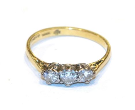 An 18 carat gold diamond three stone ring, finger size P.  Gross weight 2.3 grams. 