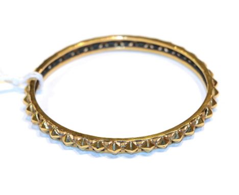 A fancy bangle, unmarked .  Gross weight 17.8 grams