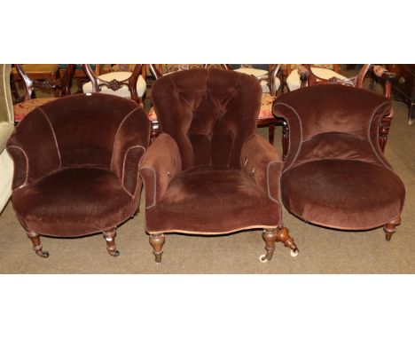 A Victorian button back nursing chair; together with two tub chairs upholstered in brown fabric (a.f.)