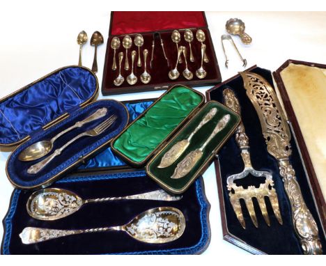 A quantity of various silver flatware, including: a cased pair of fish-servers; a cased set of twelve teaspoons and sugar ton