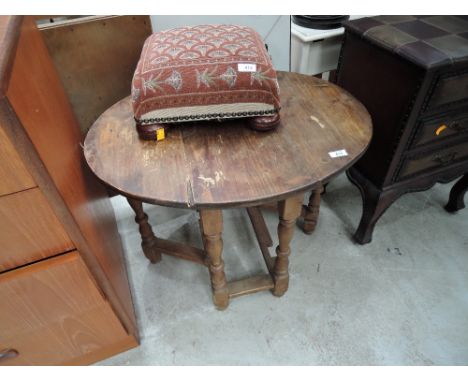 A modern stripped occasional gate leg table
