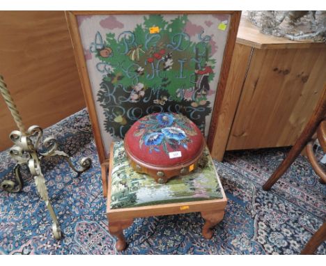 A Victorian beadwork footstool , a tapestry footstool and an oak firescreen