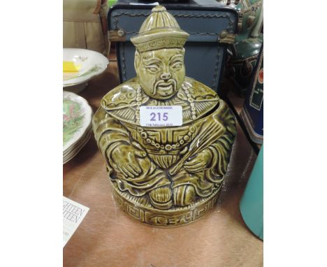 A ceramic tea jar with figural Chinese man design