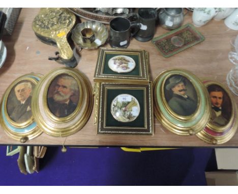 A selection of wall mounted ceramic plaques and musical box gilt effect pictures
