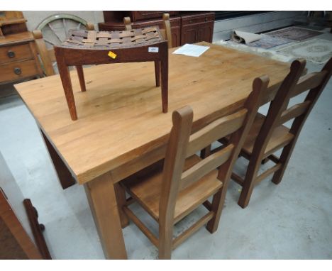 A modern kitchen table and set of 4 ladder back chairs