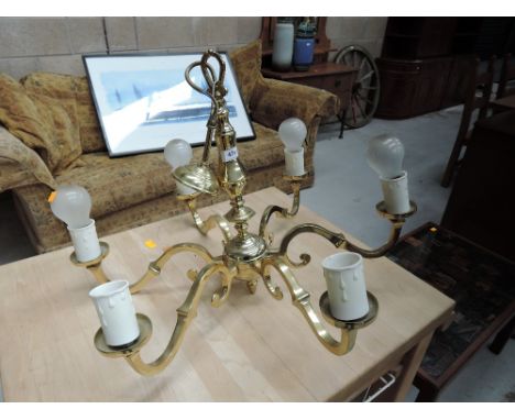 A brass ceiling light fitting