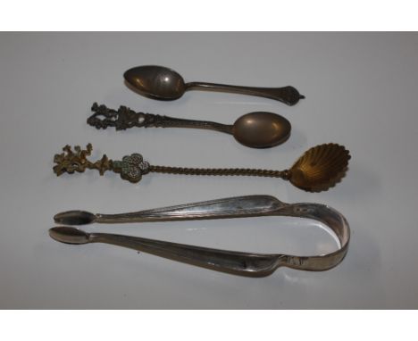 A pair of silver sugar nips; a yellow metal and enamel decorated fancy spoon, a silver King George VI Coronation spoon and on