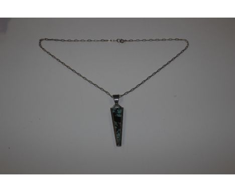 An Art Deco design silver and hardstone set pendant on chain 