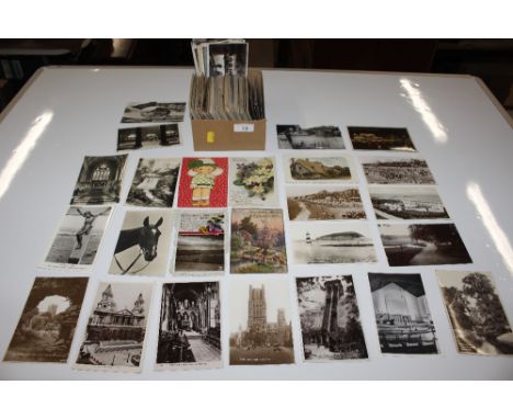 A box containing various vintage post-cards