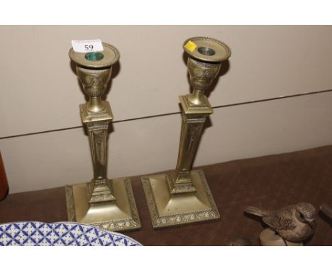 A pair of silver plated candle sticks