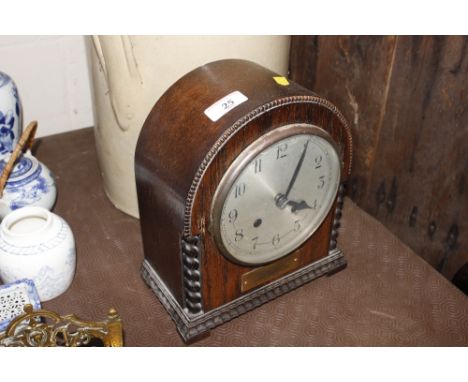 An oak cased mantel clock, presented to Captain and Mrs Griffith, dated 1933