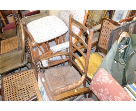 An elm ladder back and rush seated elbow chair 