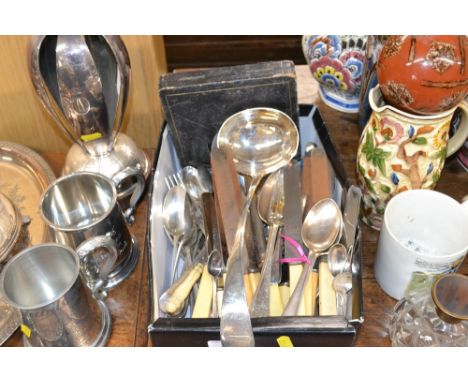 A box containing various silver plated and other cutlery