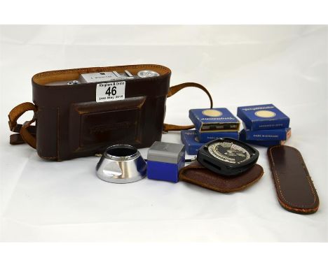 A Voigtlander Bessa I camera and case, with several filters. 