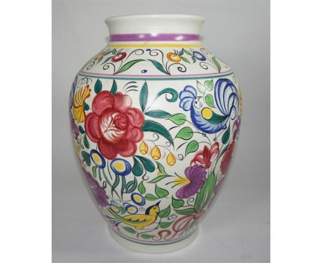 A Poole Pottery vase, depicting flowers, birds and foliage. Circa 1970. Height 36cm.