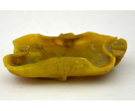 A Chinese carved jade and lotus leaf shallow dish. 10cm x 8cm.